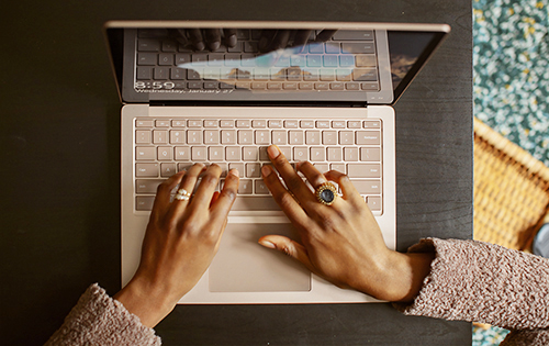 person typing on laptop